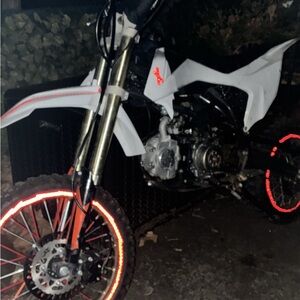 White Dirt Bike with Neon Wheel Accents